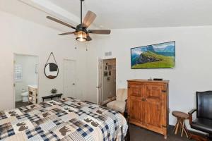 a bedroom with a bed and a ceiling fan at Fitzy's Fir Lodge - Fun For the Whole Family, Dogs Welcome, Jacuzzi Tub in Sugarloaf