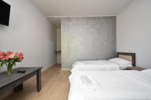 Ein Bett oder Betten in einem Zimmer der Unterkunft SIRIK