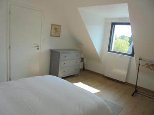 Postel nebo postele na pokoji v ubytování Maison de tourisme Conleau