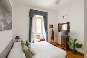 Ένα ή περισσότερα κρεβάτια σε δωμάτιο στο B&B Ibiscus