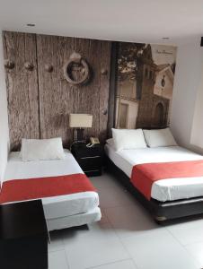 Ένα ή περισσότερα κρεβάτια σε δωμάτιο στο Puertas de San Antonio