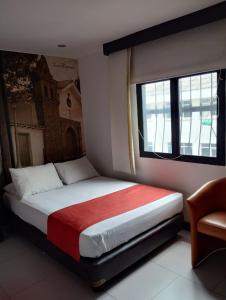 Ένα ή περισσότερα κρεβάτια σε δωμάτιο στο Puertas de San Antonio