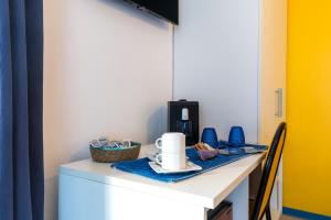 Принадлежности для чая и кофе в La Favorita Hotel