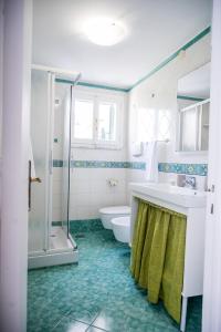 a bathroom with a tub and a sink and a shower at Terrazza Mediterranea in Vietri