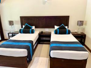 Letto o letti in una camera di Hotel Randiya Anuradhapura
