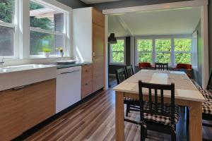 a kitchen and dining room with a table and chairs at Relaxing in Renton in Renton