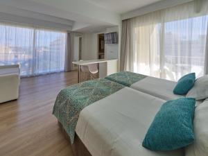 Postel nebo postele na pokoji v ubytování BQ Apolo Hotel