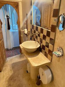 a bathroom with a sink and a mirror at Bab El Fen in Tangier +41 photos