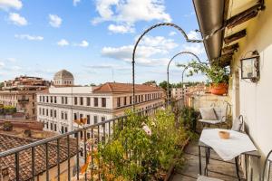 a balcony with a view of the city at Piazza Mattei Terrace Apartment | Romeloft in Rome