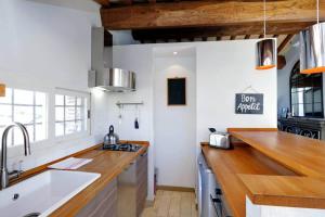 a kitchen with a sink and a counter top at Pantheon Stylish Attic in Rome