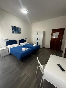 a hotel room with two beds and a table at Hotel Franca in Riolo Terme +59 photos
