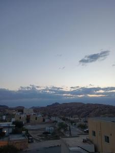 a view of a city at sunset at Its your choice hostel in Wadi Musa