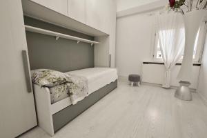 Postel nebo postele na pokoji v ubytování Attico di Piazza Cima