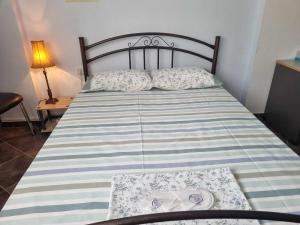 A bed or beds in a room at Houses in the Village