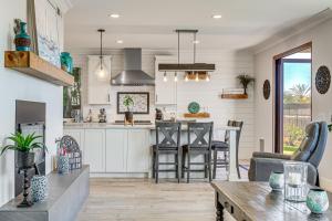 a kitchen and living room with a table and chairs at Freshly Updated Carlsbad Home 4 Mi to Beach! in Carlsbad