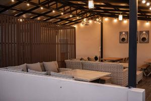 a room with couches and a table and lights at Miki House in Chumphon +26 photos