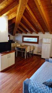a living room with a table and a dining room at Apartments Tony in Bardolino in Bardolino