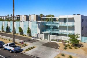 an apartment building with a truck parked in front of it at Efficient Design Concept - walk Roosevelt Row. in Phoenix