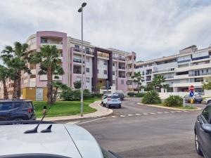 a car parked in a parking lot in front of a building at Casa Rosaria in Lecce