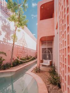 an external view of a building with a bird cage at Casa Amate 61 - Mérida centro in Mérida
