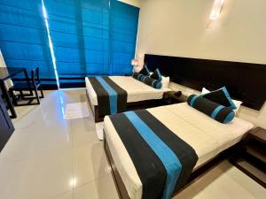 Letto o letti in una camera di Hotel Randiya Anuradhapura