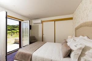 Ліжко або ліжка в номері Quinta das Secas