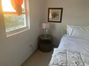 Ένα ή περισσότερα κρεβάτια σε δωμάτιο στο New condo with sea view unit 2