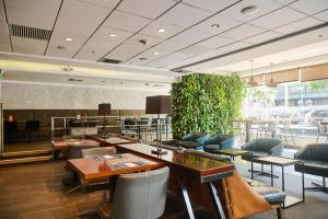 a restaurant with tables and chairs in a room at Casa Andina Select Miraflores in Lima