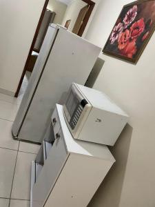 a fax machine sitting on top of a staircase at Dom Antonio 3 in Campos dos Goytacazes