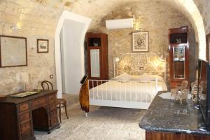 Gulta vai gultas numurā naktsmītnē Casale Arezzo - Luxury Villa With Pool & Jacuzzi - Marina di Ragusa