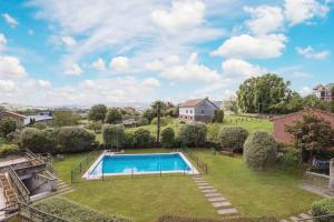 an aerial view of a yard with a swimming pool at El Rincon de las Americas in Colombres