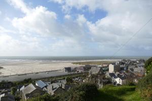 a view of a city and a beach with houses at Bae Abermaw Boutique B&B in Barmouth