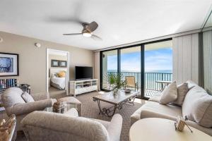 a living room with couches and a view of the ocean at One Seagrove Place 0506 in Seagrove Beach