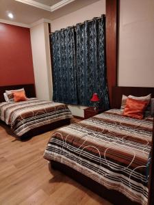 Katil atau katil-katil dalam bilik di Hotel Pegasus