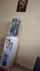 a bottle of water on top of a refrigerator at Salama Comfy Place in Naivasha