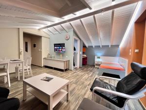 A television and/or entertainment centre at Colorful House (Attic)