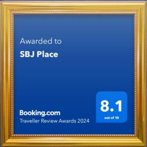 a gold picture frame with a blue background at SBJ Place East Legon in Accra