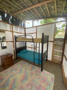Postel nebo postele na pokoji v ubytování Aloha Surf Hostel
