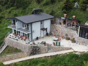 an aerial view of a house with a stone wall at Apartments Stone in Struga