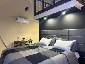 a bedroom with a large bed and a table at White Camel in Kanab