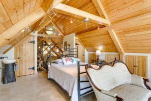 a bedroom with a bed and a wooden ceiling at Hornersville Vacation Rental with Private Pond! in Hornersville
