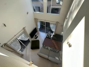 an overhead view of a living room with a couch at MORIHAKU - Vacation STAY 34551v in Kutsukake