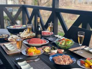 a table with plates of food and glasses of champagne at MORIHAKU - Vacation STAY 36402v in Kutsukake