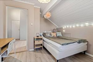 Ένα ή περισσότερα κρεβάτια σε δωμάτιο στο Sørlandsferie nær svaberg, og strender!