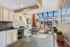 an open kitchen and living room with glass windows at Beaver Run Resort 34330 by Great Western Lodging in Breckenridge