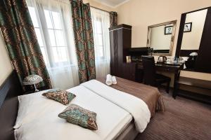 Postel nebo postele na pokoji v ubytování Hotel Willa Adriana