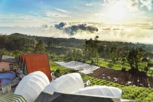 an overhead view of a farm with white domes at Azana Essence Selo Boyolali in Boyolali