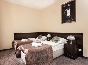 Postel nebo postele na pokoji v ubytování Hotel Willa Adriana
