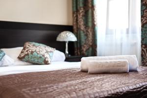 Postel nebo postele na pokoji v ubytování Hotel Willa Adriana