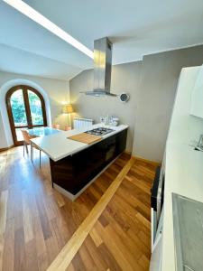 a kitchen with a counter top and a stove top oven at Villetta Ginori - Private Spa in Grosseto